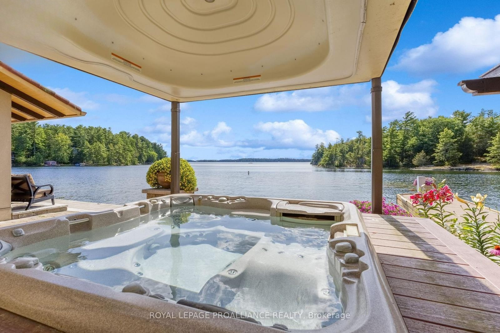 Bella Vista — lakeside hot tub with open Charleston Lake view