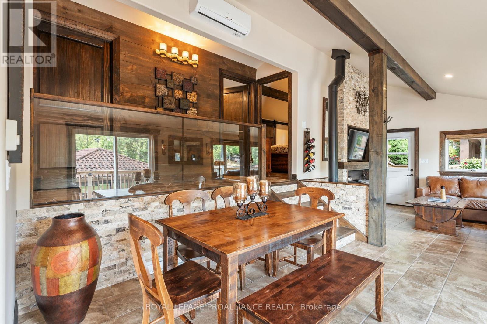 Entertainment pavilion interior — stone bar, wood beams